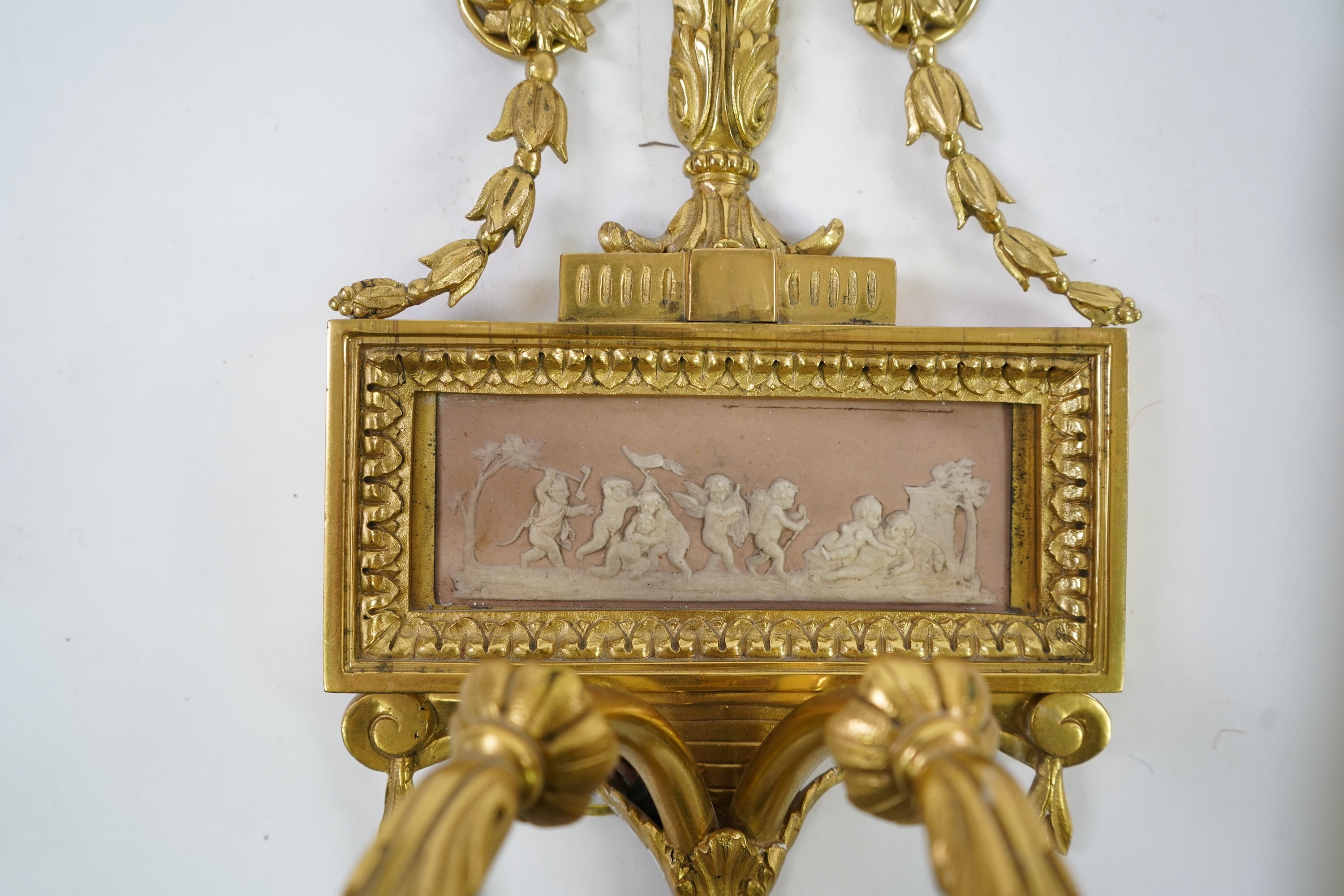 A set of four Adam style ormolu and jasper ware mounted wall appliques, early 20th century